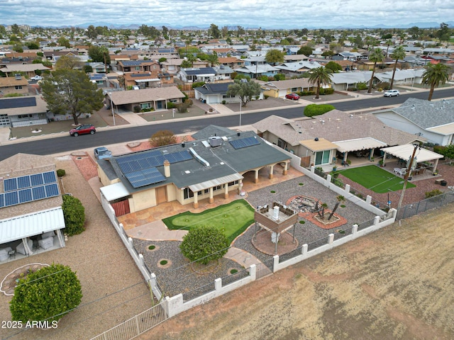 birds eye view of property with a residential view