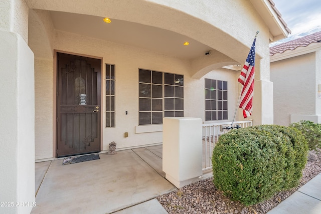 doorway to property with stucco siding