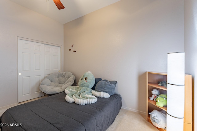 bedroom featuring light carpet, ceiling fan, and baseboards