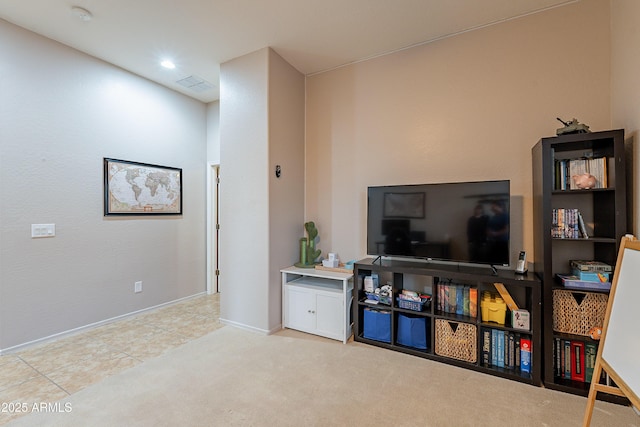 carpeted living area featuring recessed lighting, visible vents, and baseboards