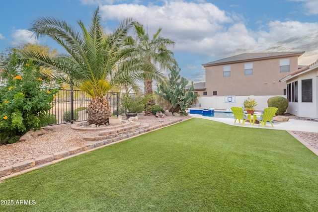 view of yard featuring a patio area, a fenced backyard, and a fenced in pool