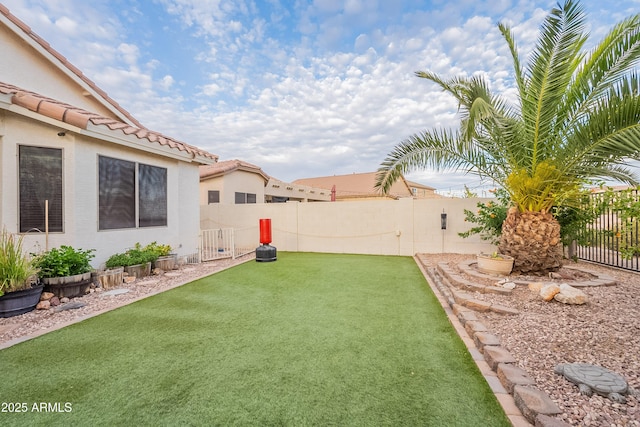 view of yard featuring a fenced backyard