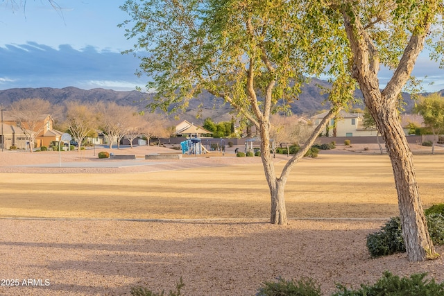 view of property's community featuring a mountain view and playground community