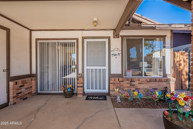 property entrance with a patio area