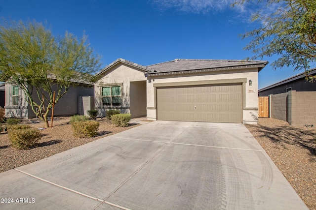 single story home with a garage