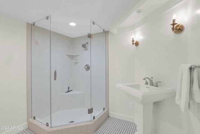 bathroom with a shower with shower door