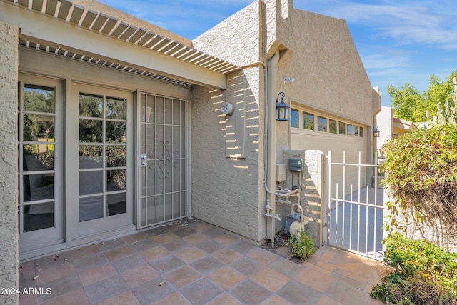 doorway to property featuring a garage