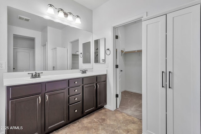 bathroom with vanity and tile patterned flooring