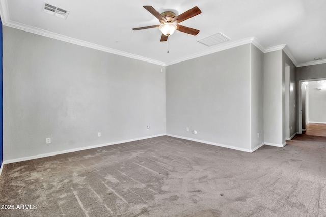 empty room with ceiling fan, crown molding, and dark colored carpet