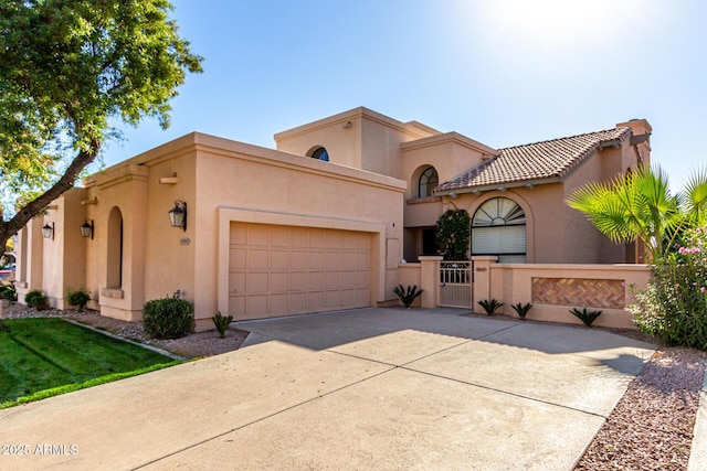 mediterranean / spanish house featuring a garage