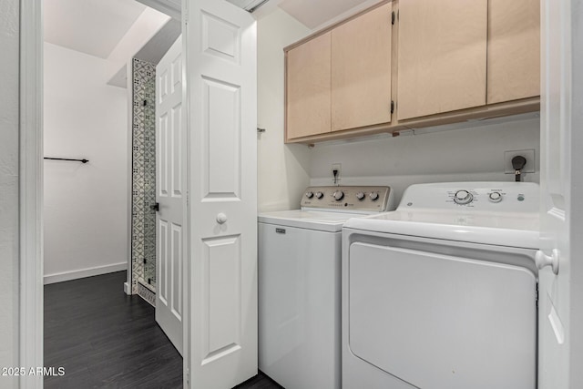 laundry room featuring separate washer and dryer, cabinets, and dark hardwood / wood-style floors