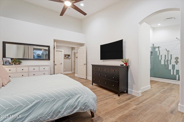 3604 E Derringer Way, Gilbert, AZ 85297 - bedroom with light wood-style flooring, arched walkways, baseboards, ensuite bathroom, and recessed lighting