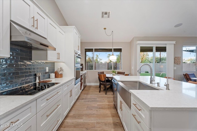 3604 E Derringer Way, Gilbert, AZ 85297 - kitchen featuring under cabinet range hood, a sink, stainless steel appliances, white cabinetry, and tasteful backsplash