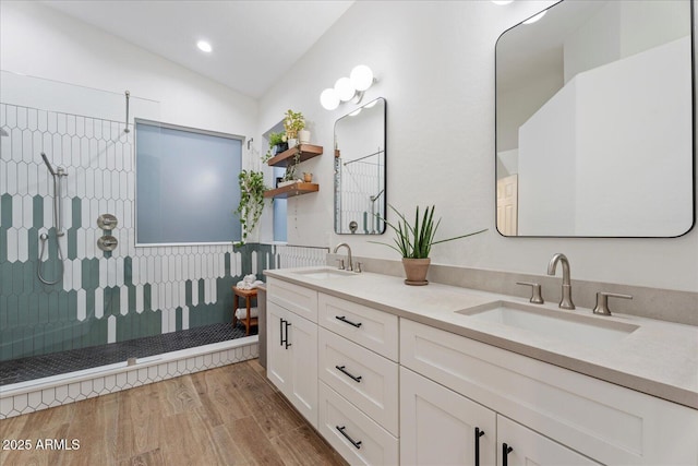 3604 E Derringer Way, Gilbert, AZ 85297 - bathroom with vaulted ceiling, wood finished floors, walk in shower, double vanity, and recessed lighting