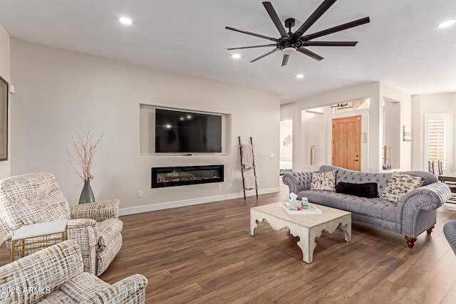 living room with ceiling fan and dark hardwood / wood-style floors