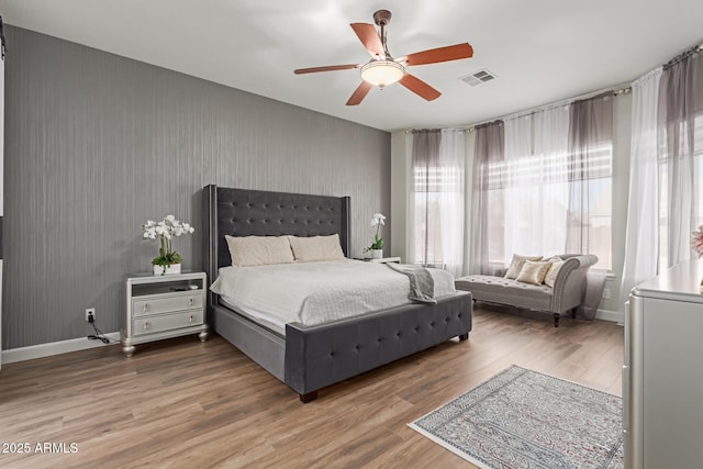 bedroom featuring hardwood / wood-style flooring and ceiling fan