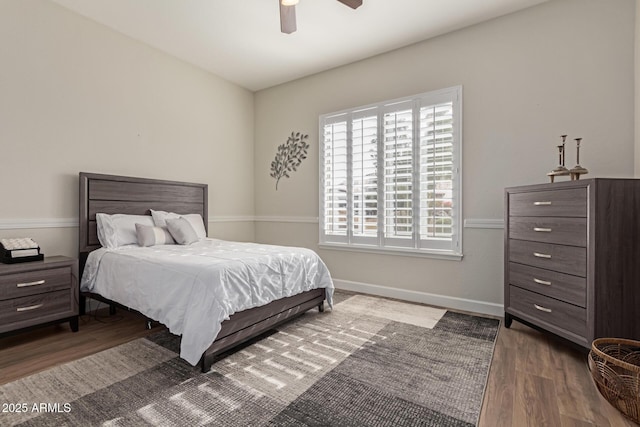 bedroom featuring dark hardwood / wood-style floors and ceiling fan