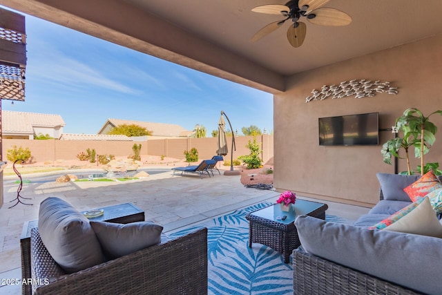 view of patio featuring ceiling fan and outdoor lounge area