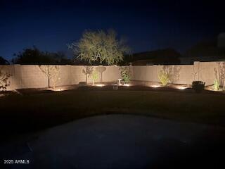 view of yard at twilight