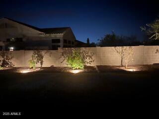 view of yard at twilight