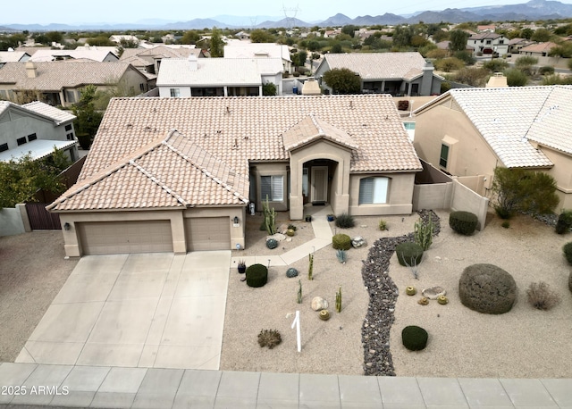 view of front of house with a garage and a mountain view