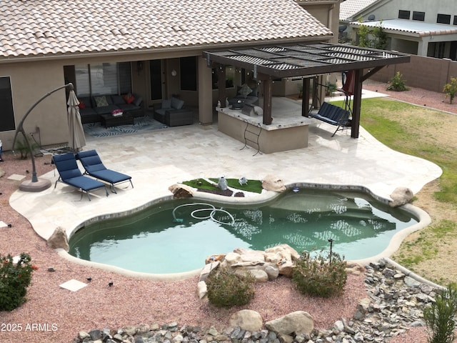 view of swimming pool with an outdoor living space and a patio area