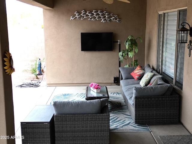 view of patio / terrace with ceiling fan and outdoor lounge area