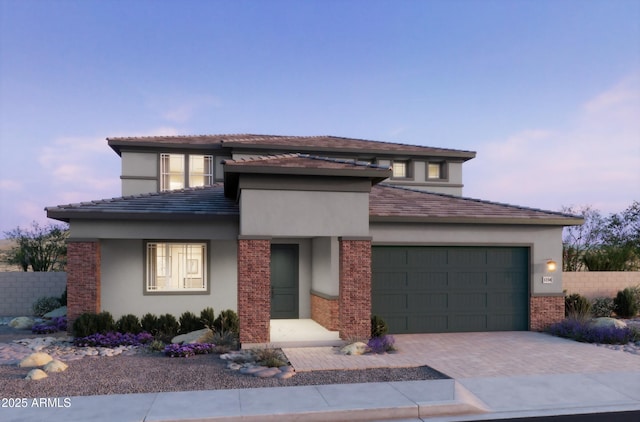 43727 N Wollemi St, Queen Creek, AZ 85140 - prairie-style home with stucco siding, an attached garage, and decorative driveway