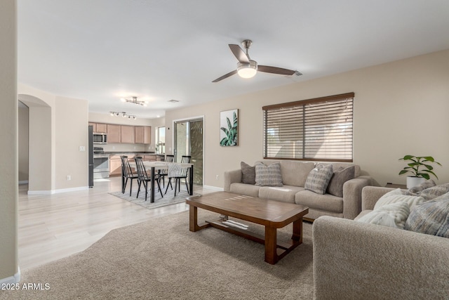 living room featuring ceiling fan