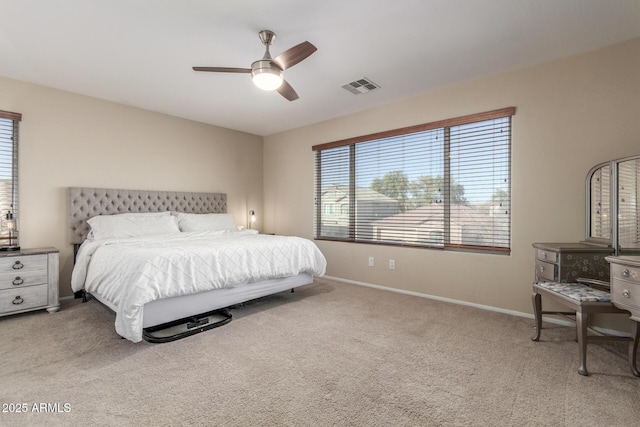 bedroom featuring ceiling fan and light colored carpet