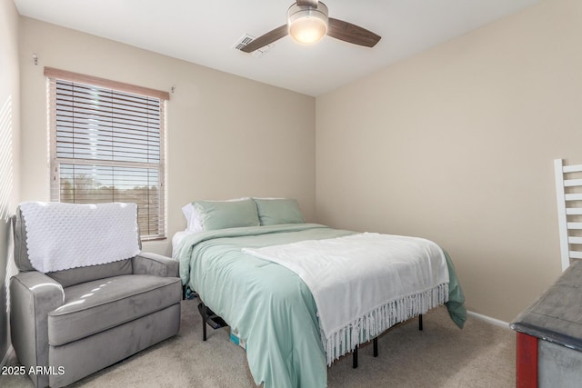 bedroom featuring light carpet and ceiling fan