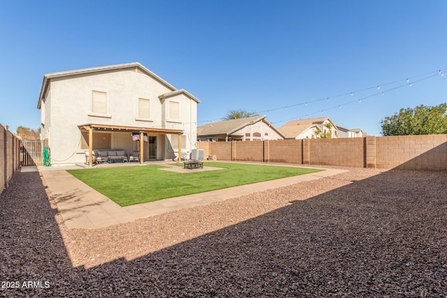 back of house featuring a patio area, central air condition unit, and an outdoor fire pit