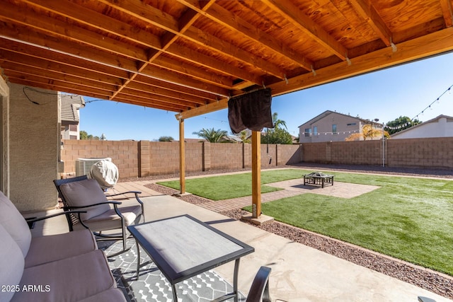 view of patio with cooling unit and a fire pit