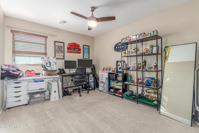 office space featuring ceiling fan and light colored carpet