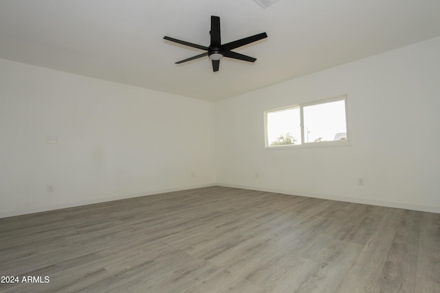 unfurnished room with ceiling fan and light hardwood / wood-style flooring