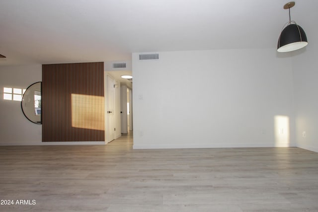 spare room featuring light hardwood / wood-style floors