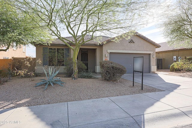 ranch-style home featuring a garage