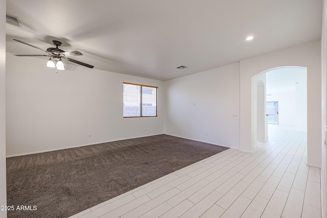 unfurnished room featuring ceiling fan