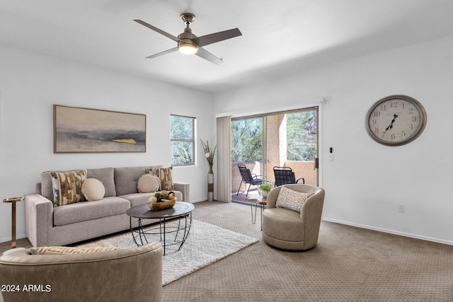 living room with carpet and ceiling fan