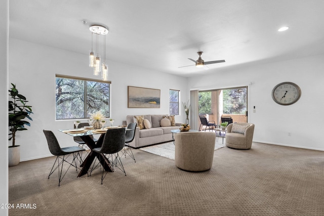 living room featuring ceiling fan and carpet floors