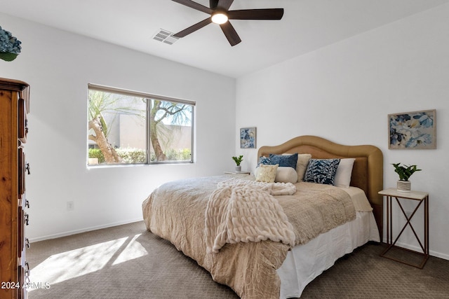 bedroom with ceiling fan and carpet floors