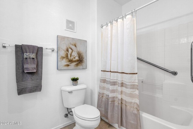 bathroom with shower / bath combination with curtain, toilet, and tile patterned floors