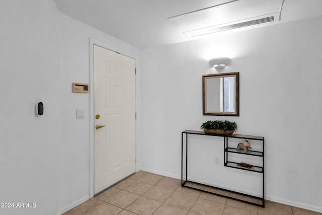 entryway featuring light tile patterned flooring