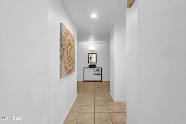 corridor featuring light tile patterned flooring