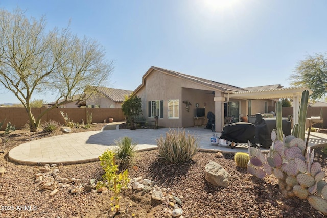 back of property featuring a patio area