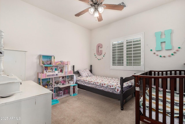 bedroom featuring ceiling fan and light carpet