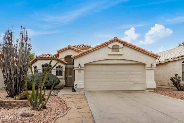 mediterranean / spanish-style home featuring a garage