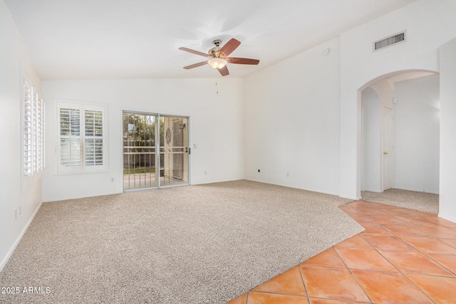 unfurnished room featuring lofted ceiling, light carpet, and ceiling fan