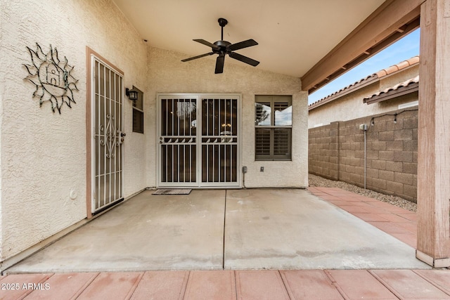 view of patio featuring ceiling fan