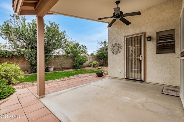 view of patio featuring ceiling fan